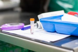 blood in a tube resting on a table