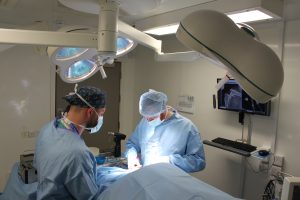 surgery being performed in an operating theatre
